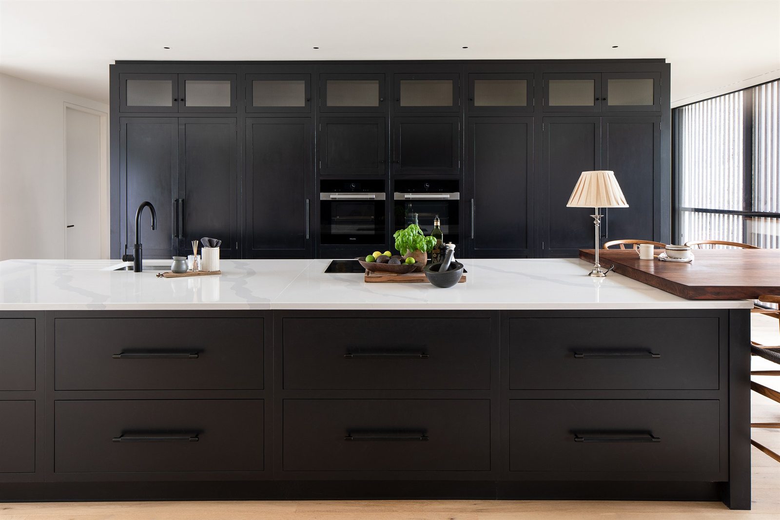 Full House Refurbishment 3 Main kitchen with dark cabinetry and stone island