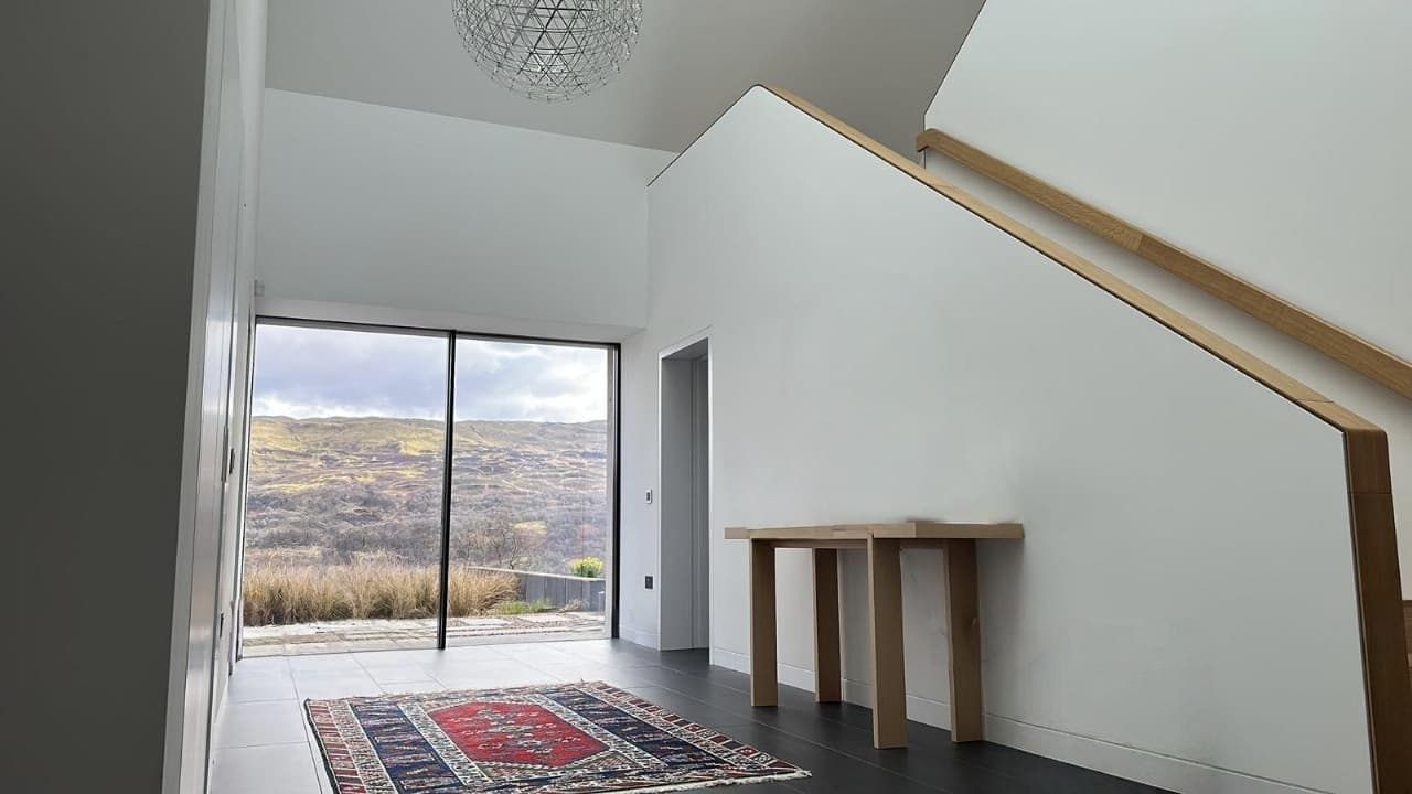 High-End Residential Property 3 The double-height atrium entrance with bespoke oak doors